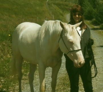 Cremello Quarter Horse Kitty and the author Dr. Glynis Giddings