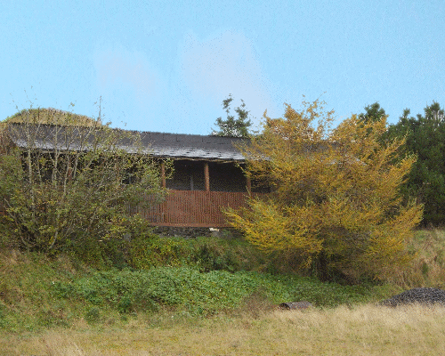 The covered walkway overlooks the stables and arena area.